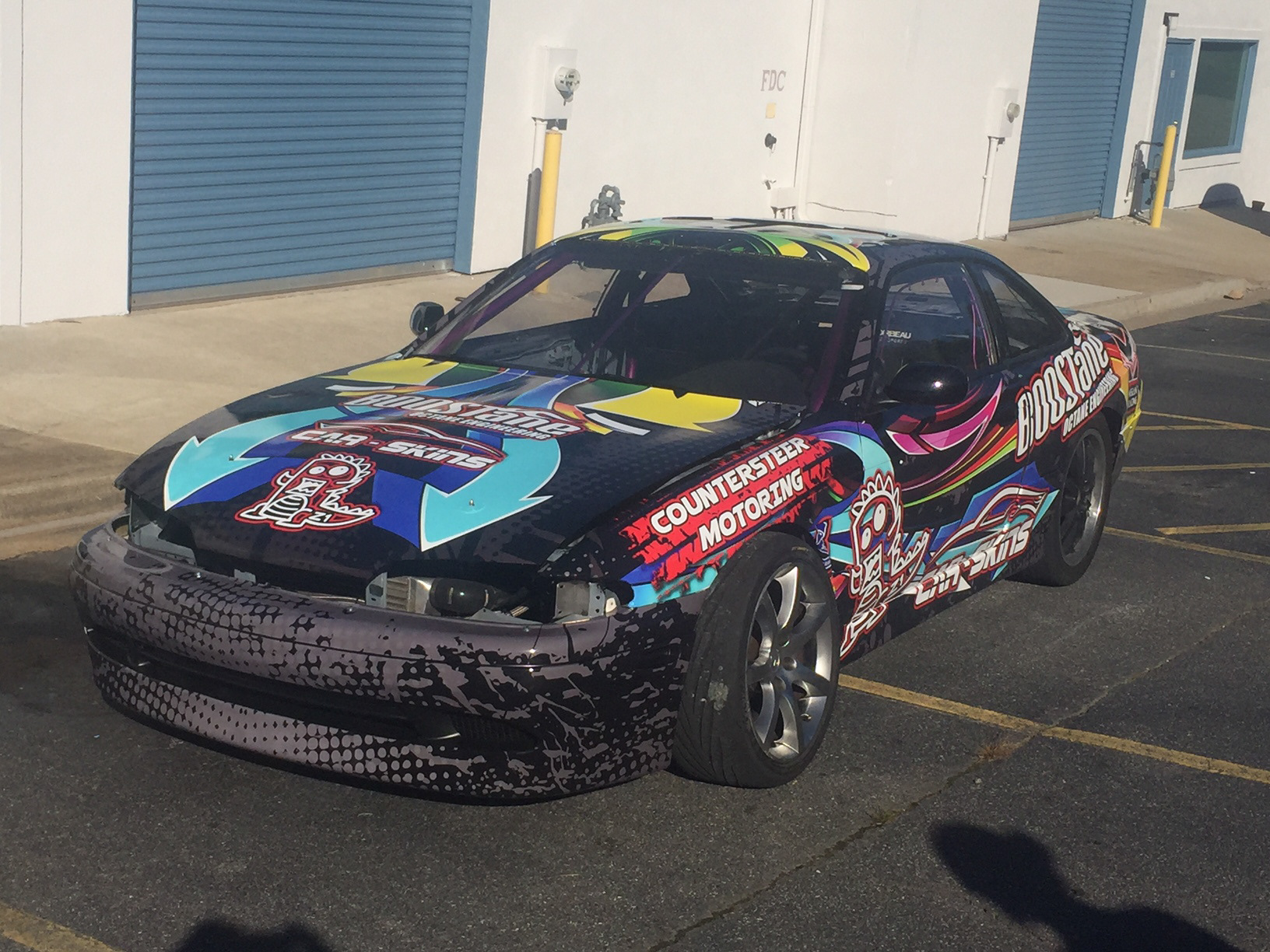 Nissan 240SX with original multicolored Wraptor drift graphics.