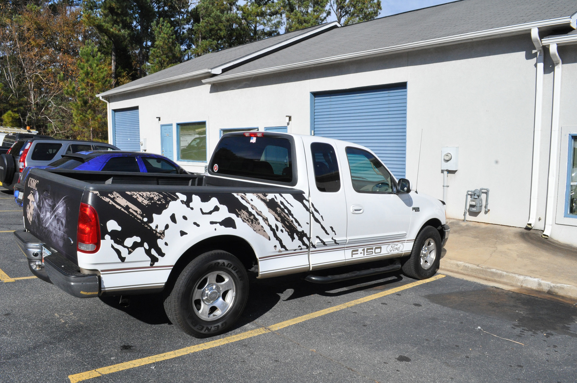 Ford F-150 with printed splatter graphics produced by Wraptor Graphix.