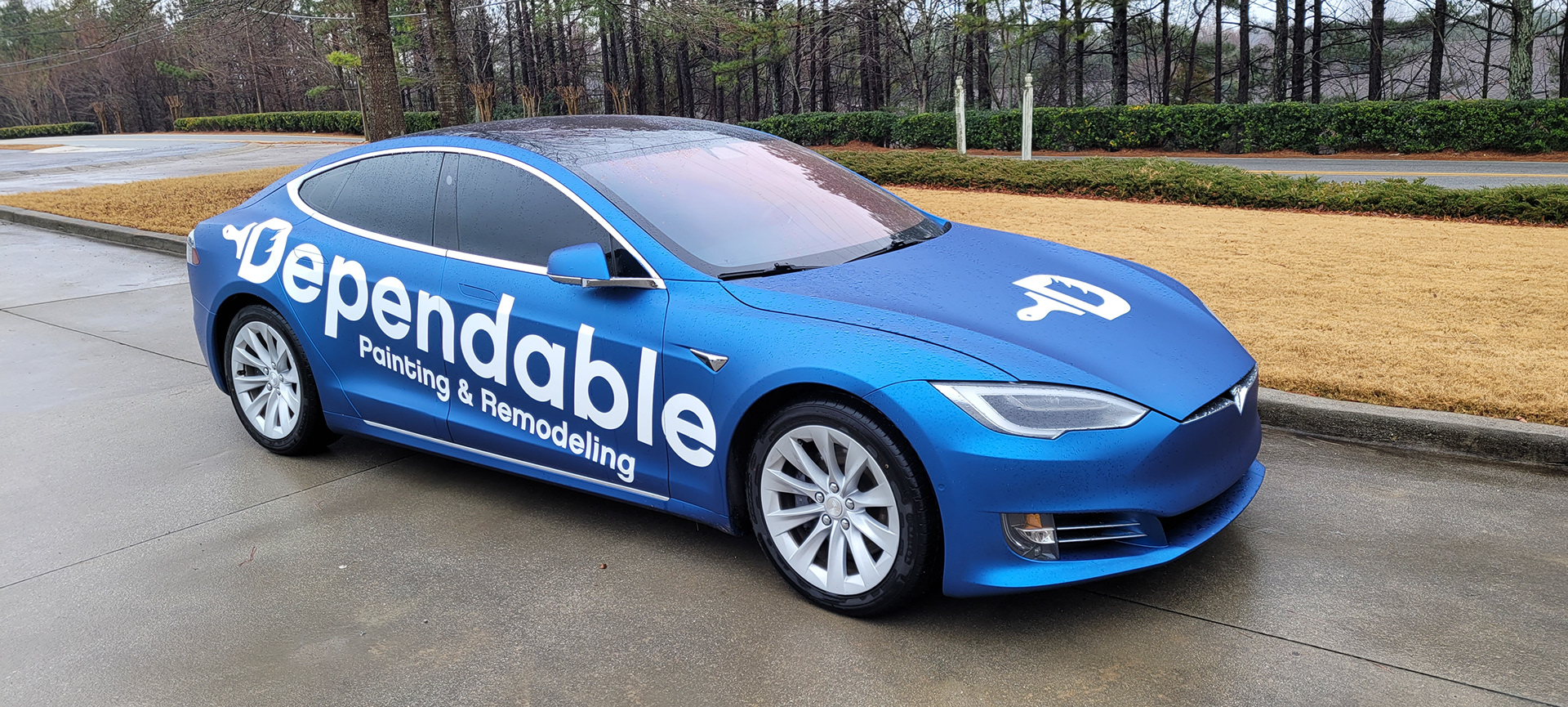 Dependable Painting company car with focused white lettering and spot graphics.