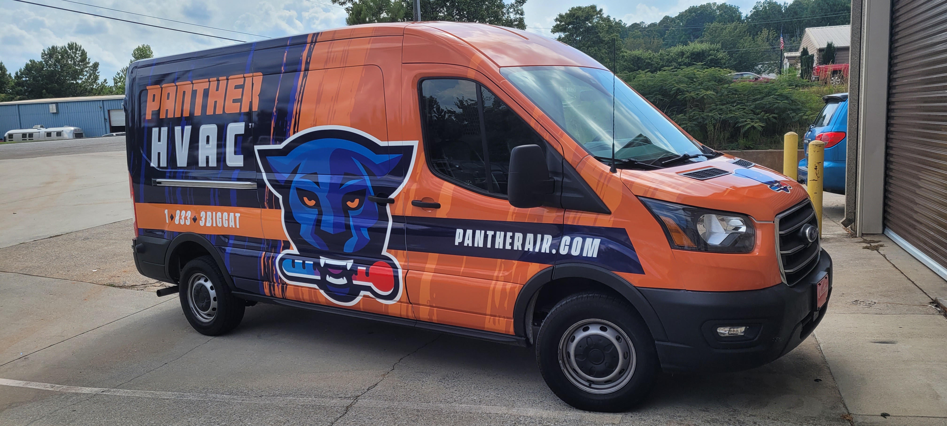 Panther HVAC service van with a full orange and navy commercial wrap.